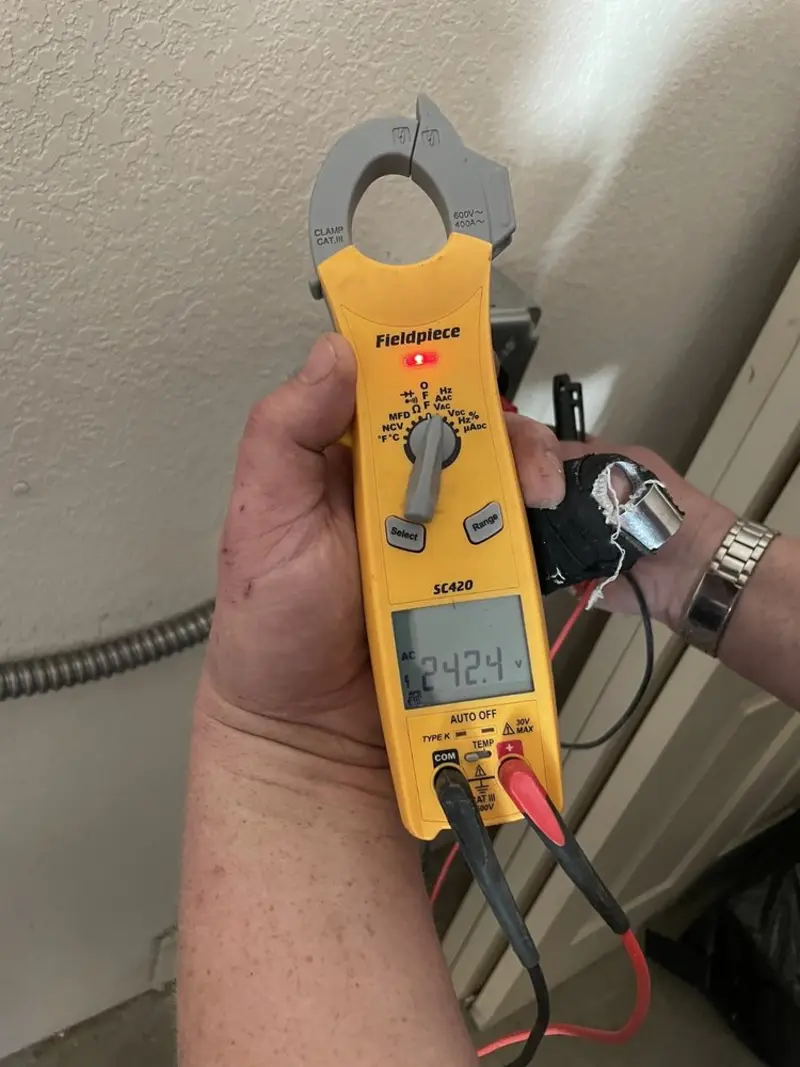 Voltage testing with clamp meter during Outlet Installation in Heath
